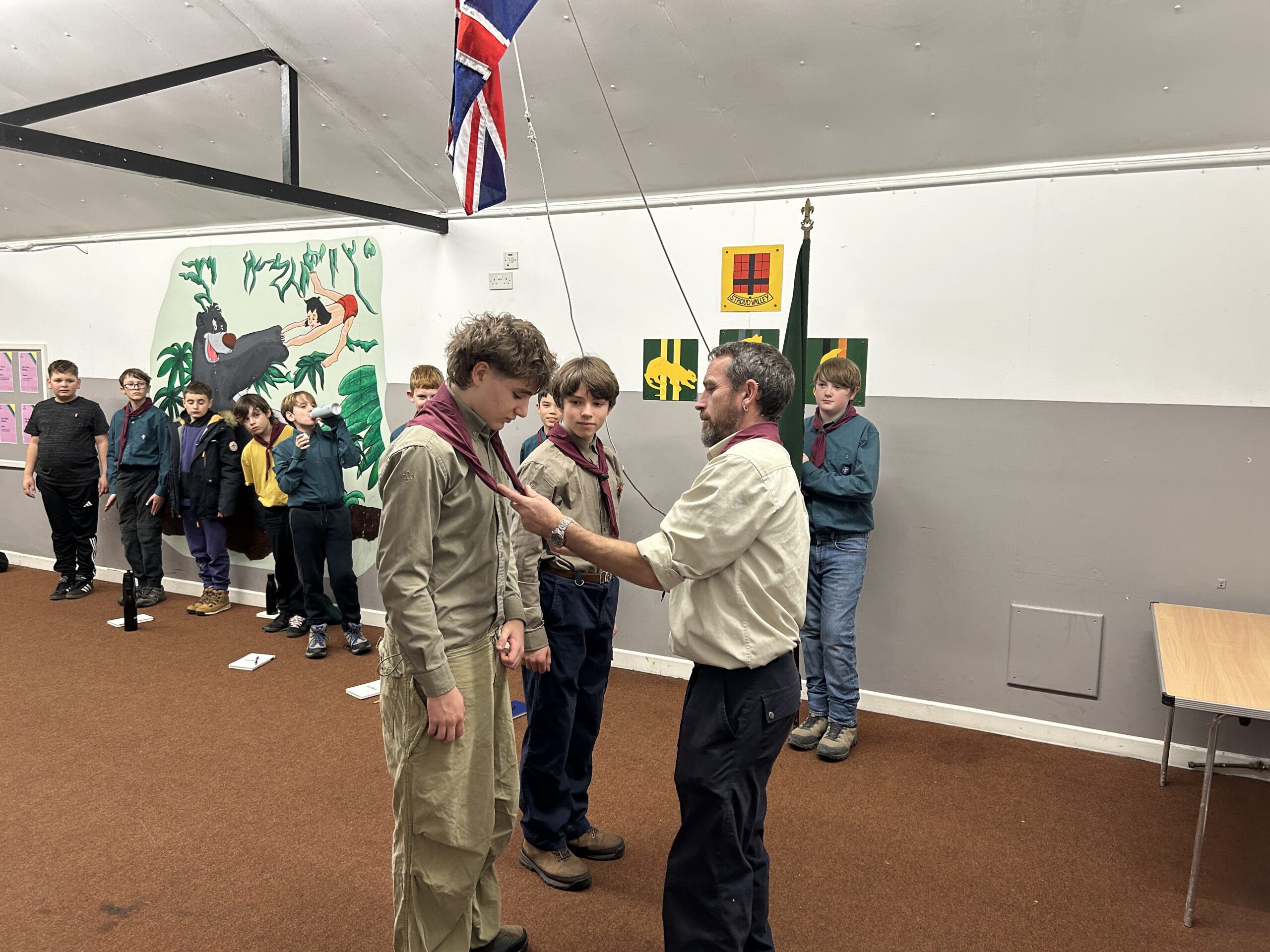 Young Leaders Dylan, Saxon and Henry pictured with leaders at Stroud Valley Scouts