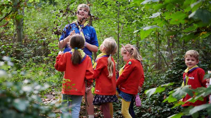 Squirrels with a leader outside at Stroud Valley Scouts
